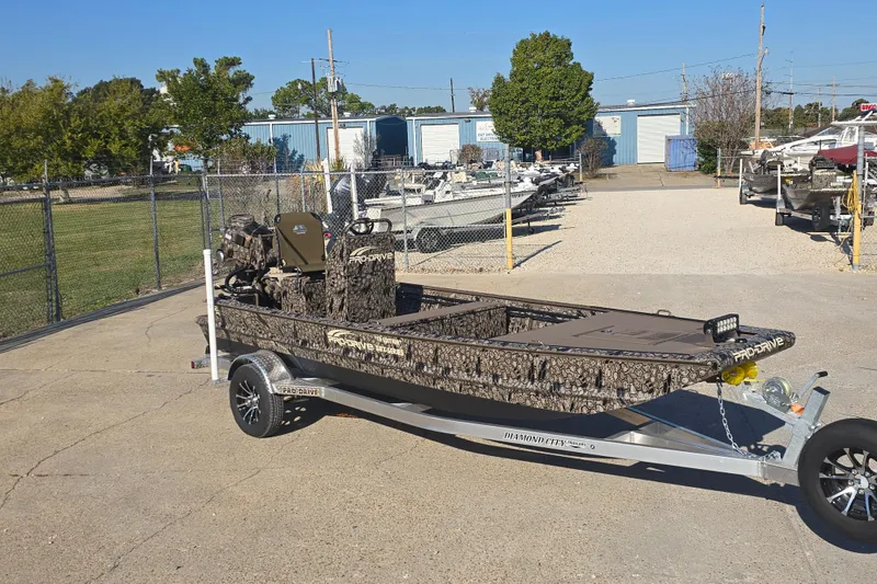 Slide: The Image of 2026 Pro-Drive 1856 SBX TD boat on trailer in outdoor dealership lot. - 1