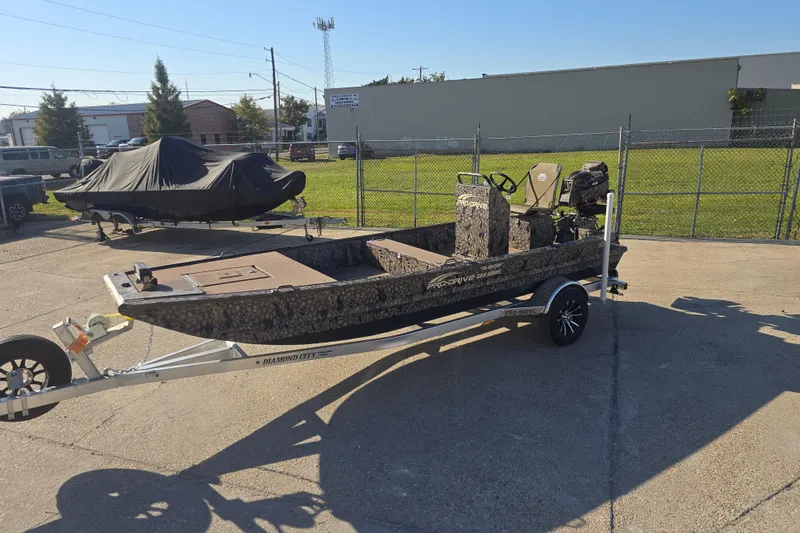 Slide: The Image of 2026 Pro-Drive 1856 SBX TD boat on trailer in outdoor setting. - 12
