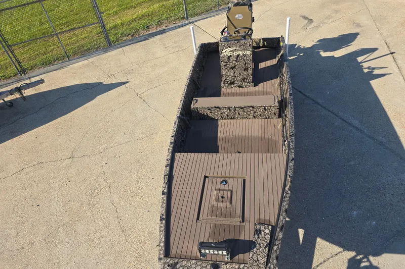 Slide: The Image of 2026 Pro-Drive 1856 SBX TD boat on concrete surface, top view. - 2