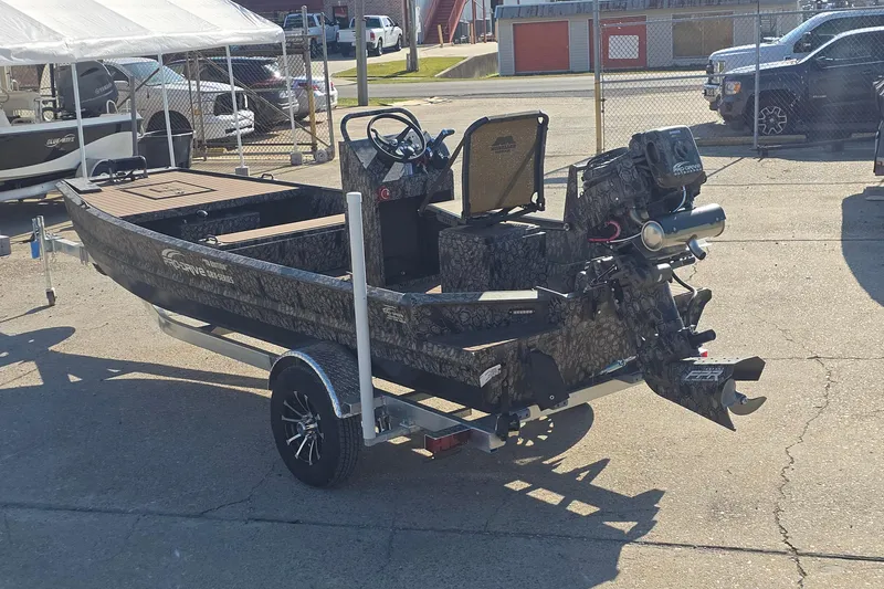 Slide: The Image of 2026 Pro-Drive 1856 SBX TD boat on trailer, parked outdoors in a lot. - 4