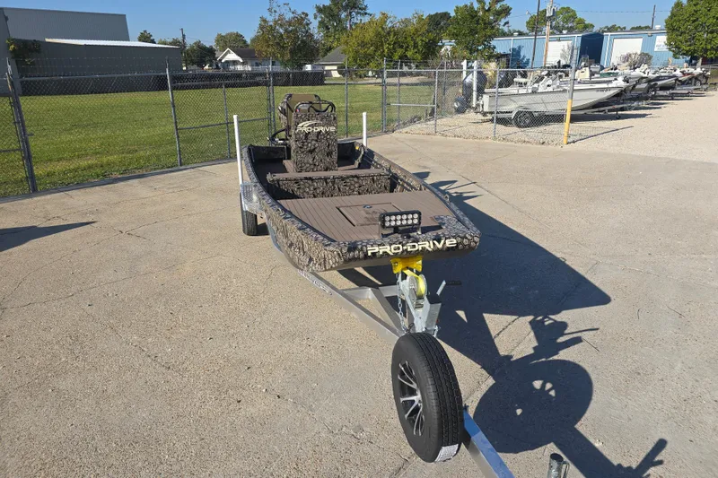 Slide: The Image of 2026 Pro-Drive 1856 SBX TD boat on trailer in outdoor setting. - 7