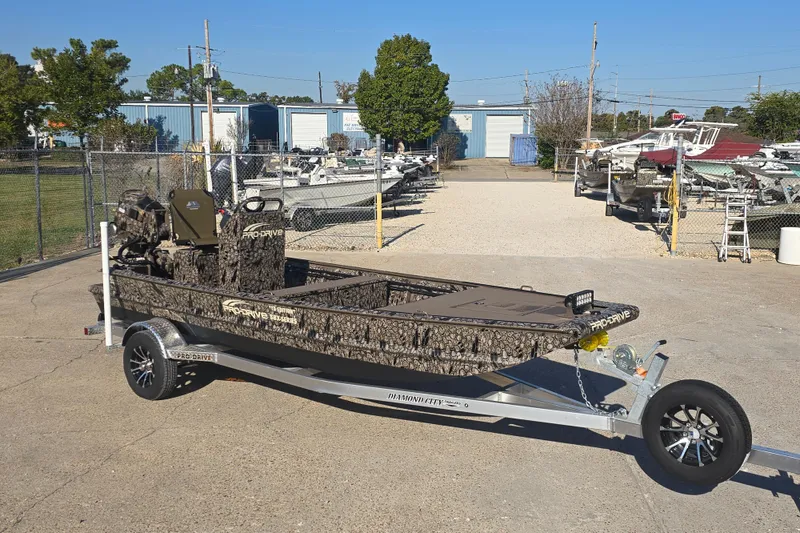 Slide: The Image of 2026 Pro-Drive 1856 SBX TD boat on trailer in outdoor lot. - 8
