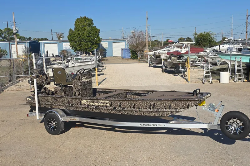 Slide: The Image of 2026 Pro-Drive 1856 SBX TD boat on trailer in outdoor lot. - 9
