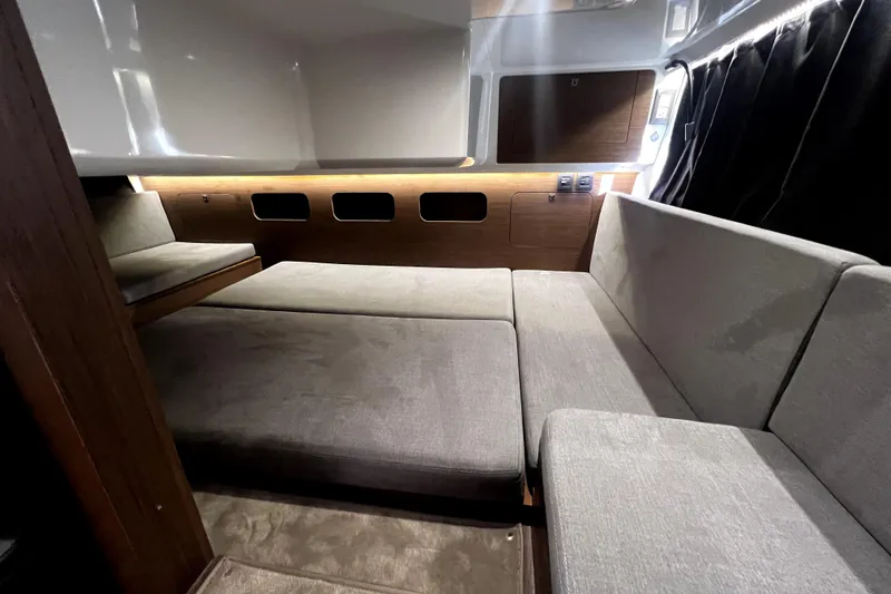 Slide: The Image of Interior of 2023 Beneteau Antares 11 Fly, featuring modern seating and ambient lighting. - 17