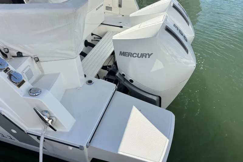 Slide: The Image of 2023 Beneteau Antares 11 Fly with dual Mercury outboard engines on water. - 20