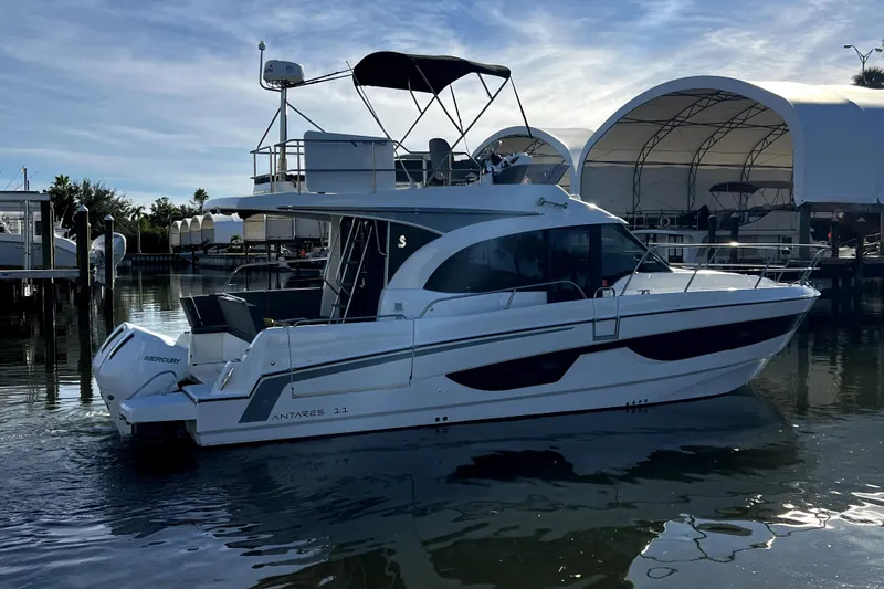 Slide: The Image of 2023 Beneteau Antares 11 Fly yacht docked in marina, side view. - 4