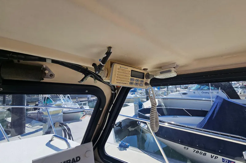 Slide: The Image of Interior view of a 2000 Parker 2520 Sport Cabin boat with marine radio equipment. - 12