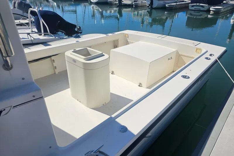 Slide: The Image of 2000 Parker 2520 Sport Cabin boat interior with open deck and storage compartments. - 5