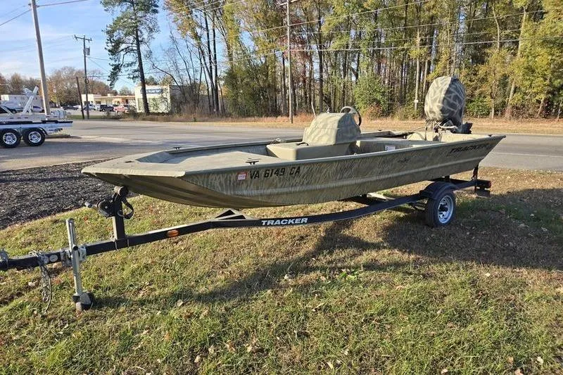 Slide: The Image of 2017 Tracker Grizzly 1648 MVX Jon boat interior with storage compartment. - 3