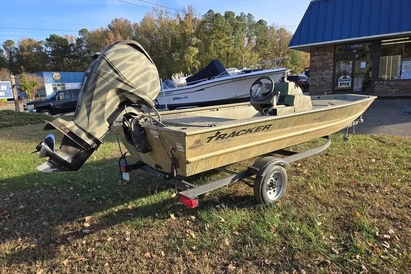 Slide: The Image of 2017 Tracker Grizzly 1648 MVX Jon boat interior with battery compartment and wiring. - 8