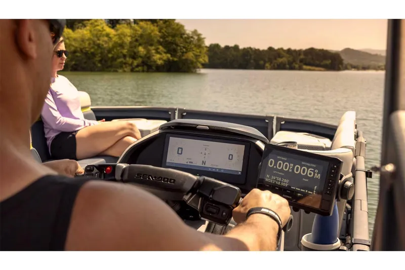 Slide: The Image of 2024 Sea-Doo Switch Cruise 21 on a serene lake, featuring advanced dashboard controls. - 11