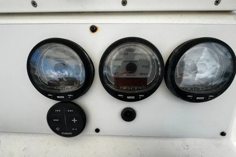 Slide: The Image of Dashboard of a 2004 Dusky 33 boat with gauges and controls. - 15
