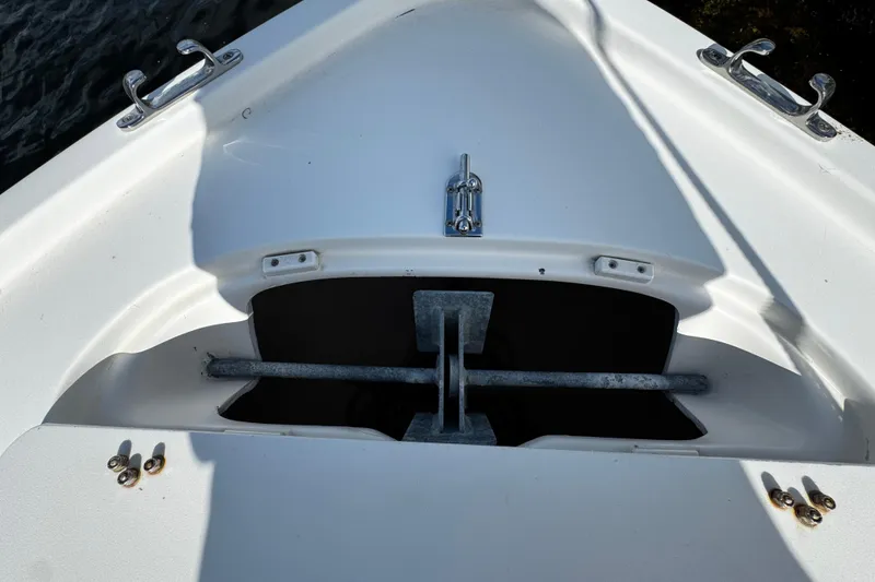 Slide: The Image of Bow of 2004 Dusky 33 boat with anchor storage and cleats. - 35