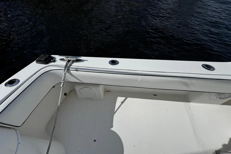 Slide: The Image of 2004 Dusky 33 boat deck with rope and water view. - 8