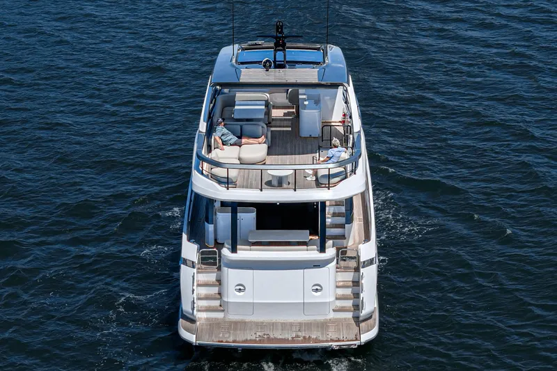 Slide: The Image of Azimut Fly 72 yacht cruising on open water, rear view, 2026 model. - 21