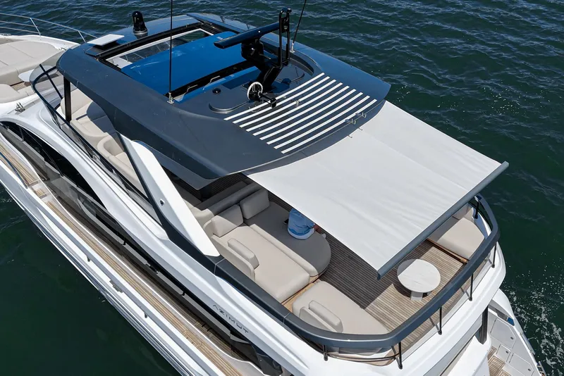 Slide: The Image of 2026 Azimut Fly 72 yacht with spacious deck and modern design on the water. - 26