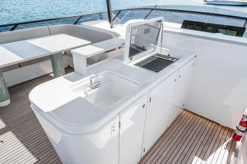 Slide: The Image of Luxurious 2026 Azimut Fly 72 yacht deck with modern outdoor kitchen and seating area. - 31