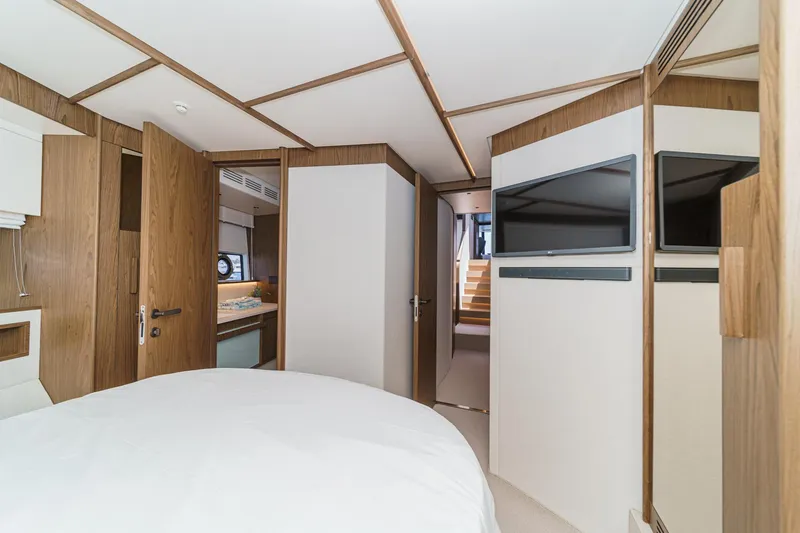 Slide: The Image of Luxurious interior of 2026 Azimut Fly 72 yacht, featuring modern wood finishes and dual TVs. - 61