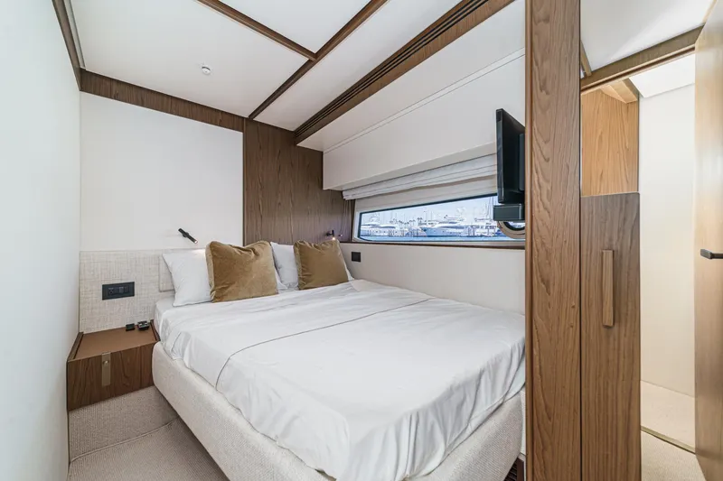 Slide: The Image of Luxurious bedroom interior of 2026 Azimut Fly 72 yacht with modern design and cozy bedding. - 64