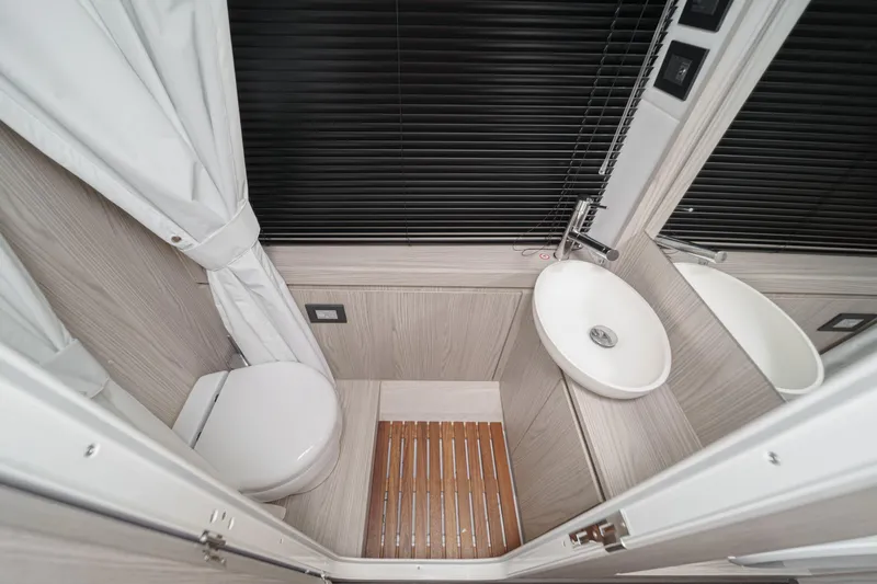 Slide: The Image of Modern bathroom interior on 2026 Azimut Fly 72 yacht, featuring sleek design and compact fixtures. - 73