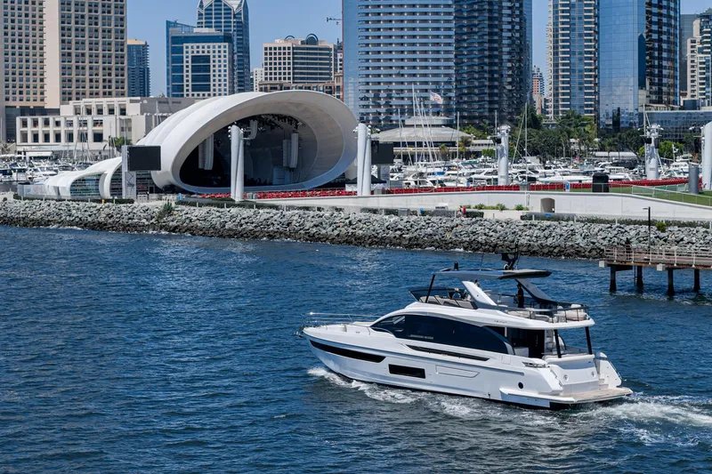 Slide: The Image of Luxury Azimut Fly 72 yacht cruising near urban waterfront, 2026 model. - 8