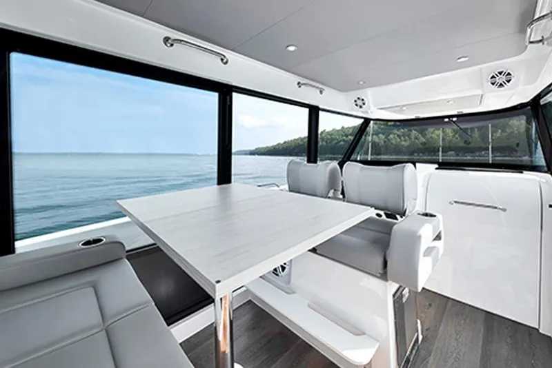 Slide: The Image of Luxurious interior of 2026 Cruisers Yachts 38 VTR with scenic ocean view. - 7