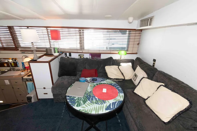 Slide: The Image of Cozy interior of a 1974 Bertram 46.6 yacht with a comfortable seating area. - 14