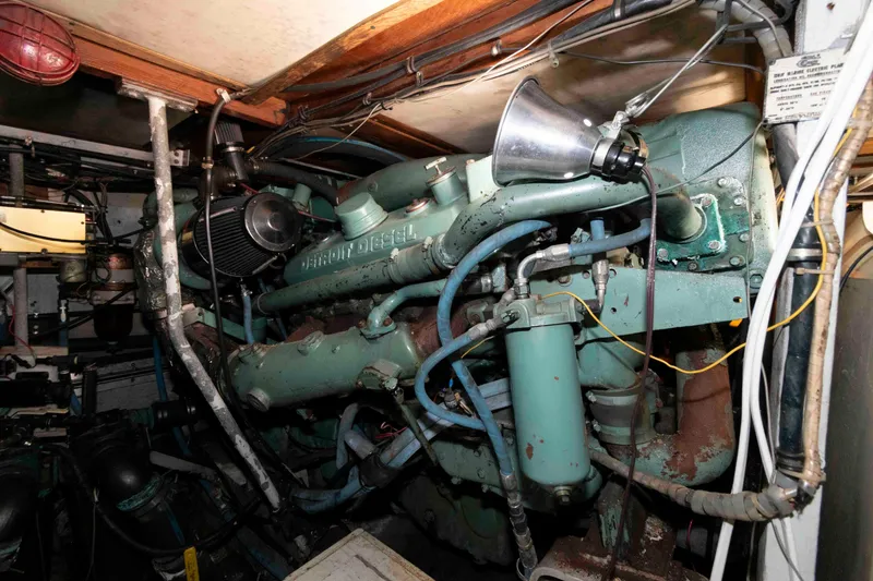 Slide: The Image of Engine room of a 1974 Bertram 46.6 yacht featuring a Detroit Diesel engine. - 26