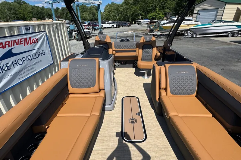 Slide: The Image of Interior view of a Harris Sunliner 250 pontoon boat with brown seating and modern design. - 20