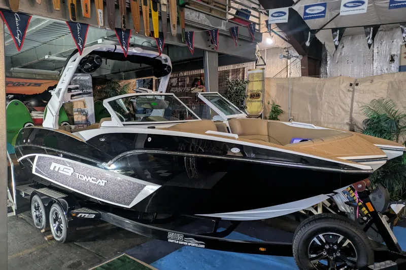 The Image of 2026 MB F22 Tomcat Alpha boat displayed indoors with sleek design and modern features. - 0