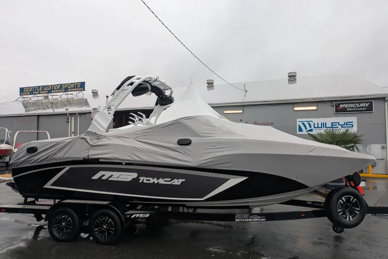 Slide: The Image of 2026 MB F22 Tomcat Alpha boat covered, parked at Seattle Water Sports. - 2