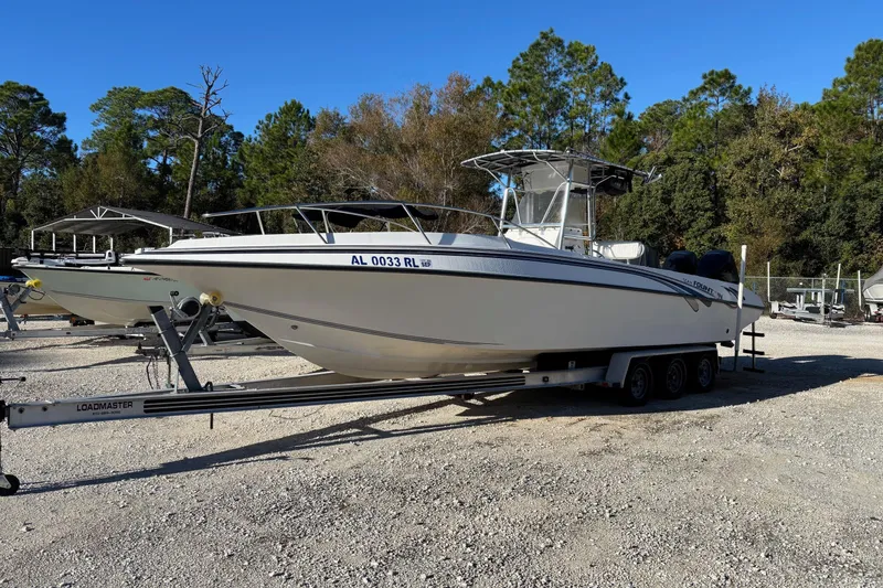 Slide: The Image of 1996 Fountain 31 Tournament Edition boat on trailer in outdoor setting. - 3