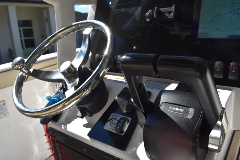 Slide: The Image of Dashboard display of 2023 Yamaha Boats 252 FSH Sport showing engine hours and speed. - 17