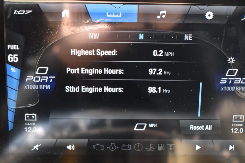 Slide: The Image of Control panel of 2023 Yamaha Boats 252 FSH Sport with various switches and displays. - 19