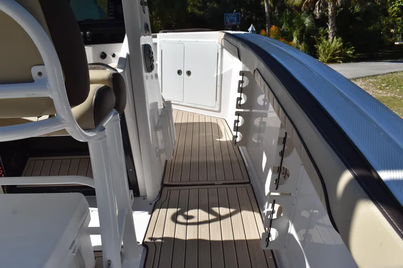 Slide: The Image of 2023 Yamaha Boats 252 FSH Sport steering wheel and dashboard controls. - 21