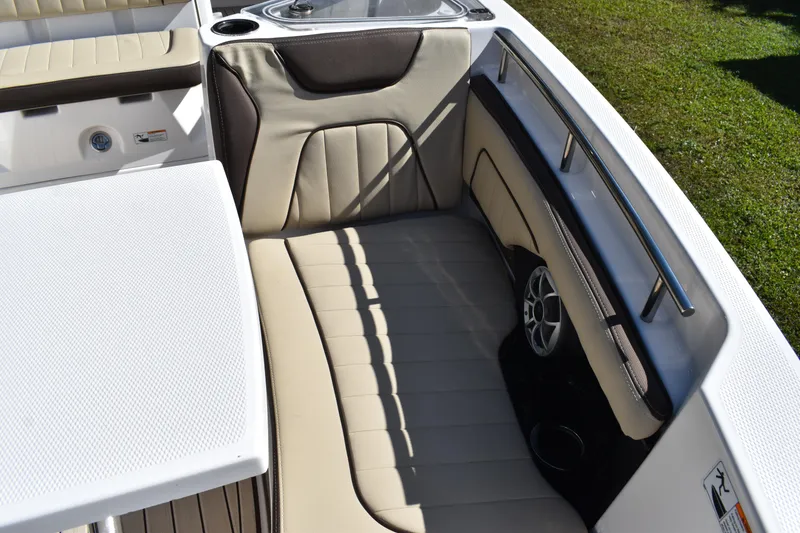 Slide: The Image of 2023 Yamaha Boats 252 FSH Sport interior with seating and storage compartments. - 26