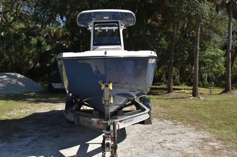 Slide: The Image of 2023 Yamaha Boats 252 FSH Sport, rear view, showcasing seating and deck features. - 3