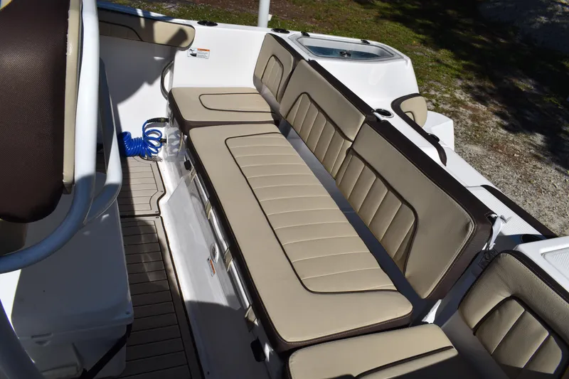 Slide: The Image of 2023 Yamaha Boats 252 FSH Sport interior view at a boat dealership. - 30