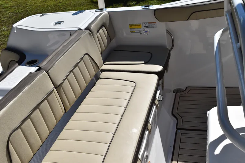 Slide: The Image of 2023 Yamaha Boats 252 FSH Sport storage compartment, open and empty, with visible hinges and latch. - 31