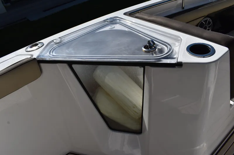 Slide: The Image of 2023 Yamaha Boats 252 FSH Sport anchor storage compartment, open on deck. - 34