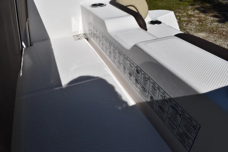 Slide: The Image of 2023 Yamaha Boats 252 FSH Sport interior, featuring spacious seating and modern design. - 36