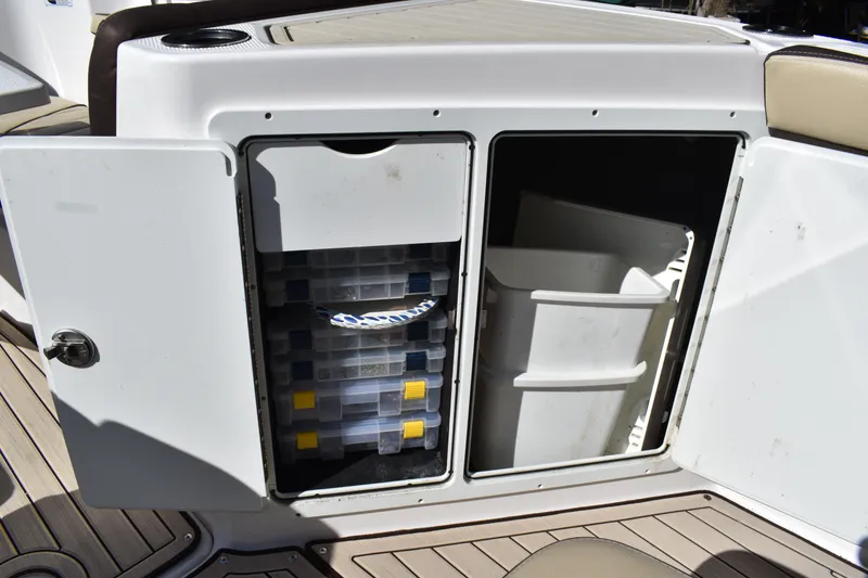 Slide: The Image of 2023 Yamaha Boats 252 FSH Sport interior with seating and storage compartments. - 38
