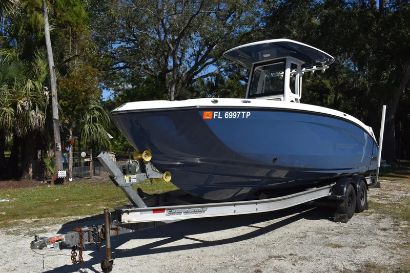Slide: The Image of Rear view of 2023 Yamaha Boats 252 FSH Sport, showcasing dual jet propulsion system. - 4