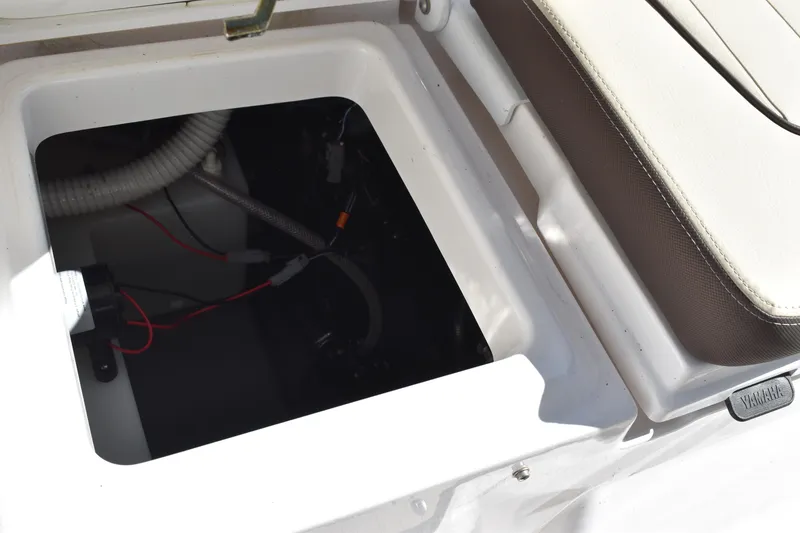 Slide: The Image of 2023 Yamaha Boats 252 FSH Sport interior with seating and storage compartments. - 41