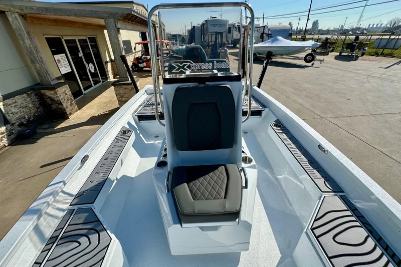 Slide: The Image of 2026 Express H20B boat with sleek design and modern seating, displayed outdoors. - 14