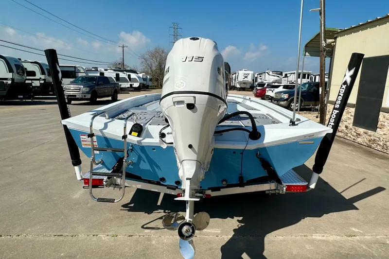 Slide: The Image of 2026 Express H20B boat with Yamaha motor on trailer, parked outdoors. - 4