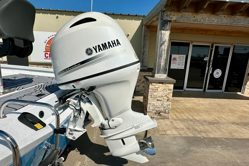 Slide: The Image of Boat with Yamaha outboard motor, Express H20B model, 2026, parked outside a building. - 6