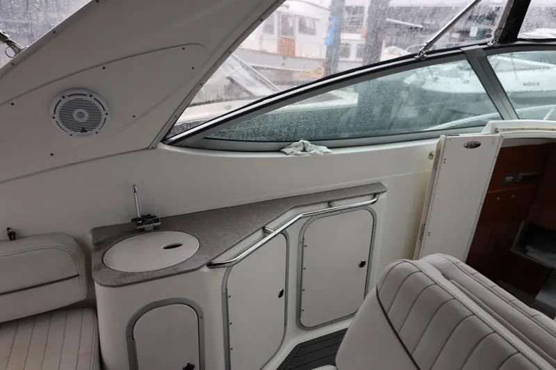 Slide: The Image of Interior of a 2005 Maxum 3300 SE boat with seating and kitchenette. - 21