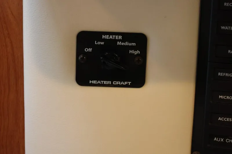 Slide: The Image of Heater control panel on 2005 Maxum 3300 SE boat. - 26