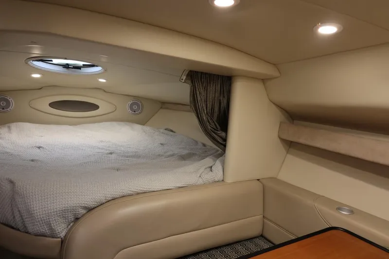 Slide: The Image of 2005 Maxum 3300 SE cabin interior with cozy bed and ambient lighting. - 40